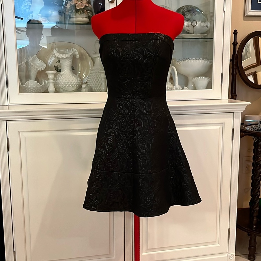 Black brocade strapless swing dress.